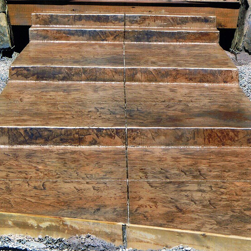 A set of concrete stairs that look like wood