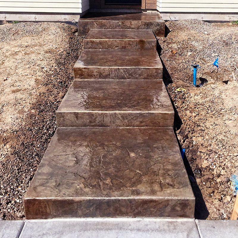 A set of concrete steps leading up to a house
