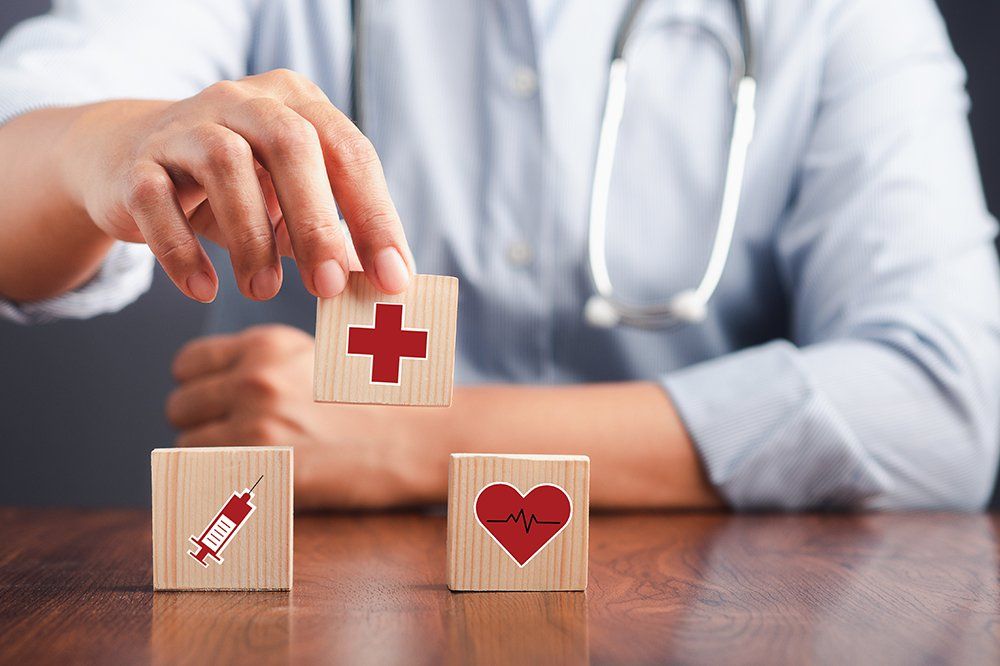 A Doctor Holding Wooden Dice With Icons