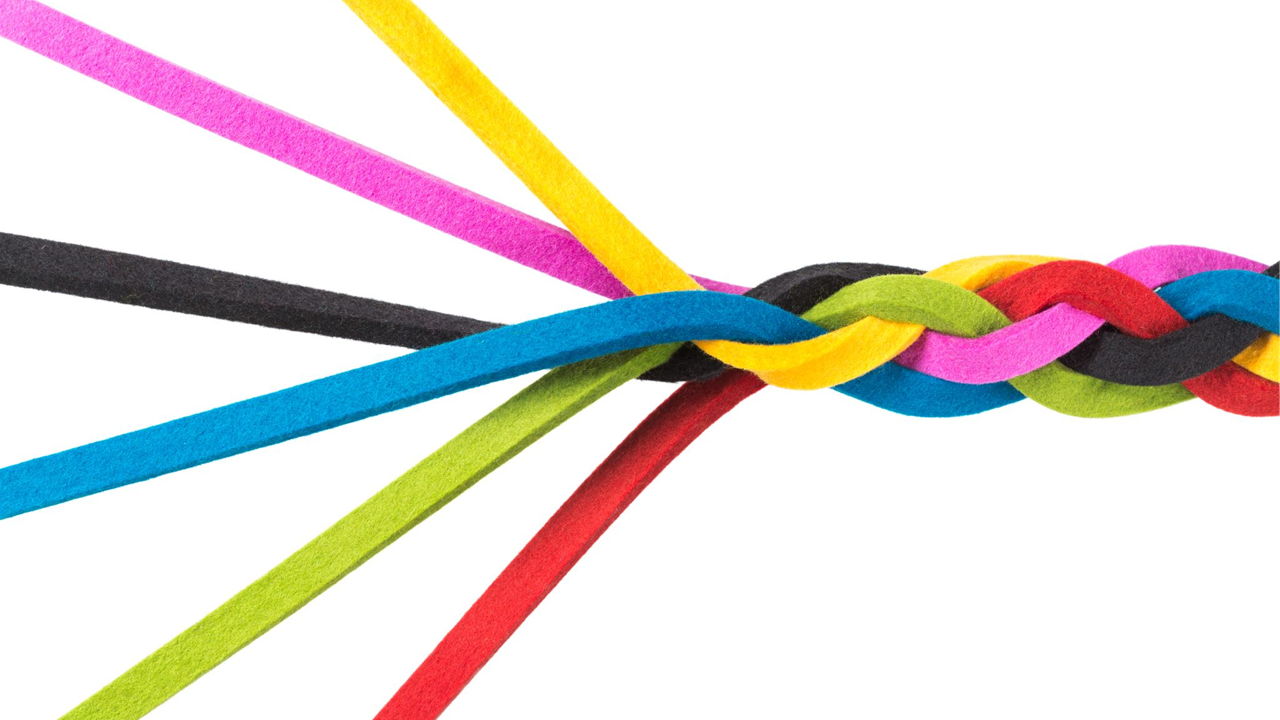Colorful strands braided together, symbolizing unity and collaboration.