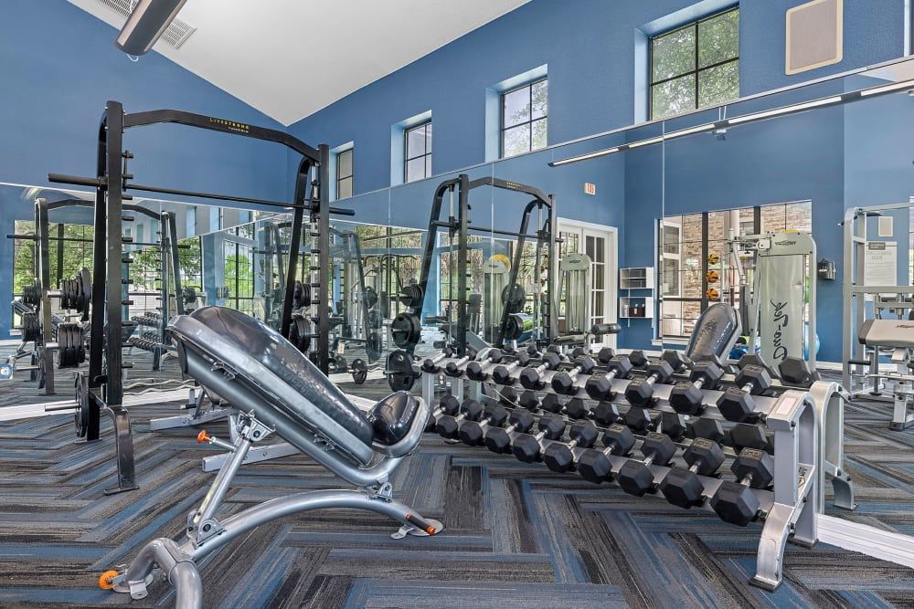 a lot of dumbbells in the gym at Marquis Parkside in Austin, TX.