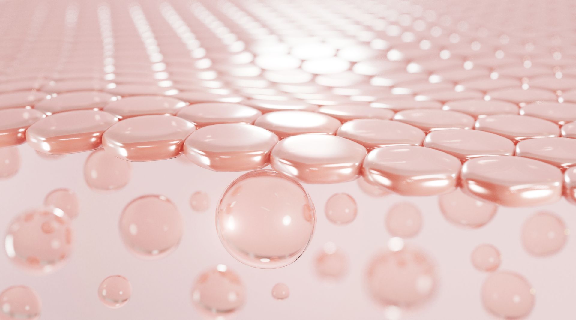 A bunch of pink cells are floating on a white surface.