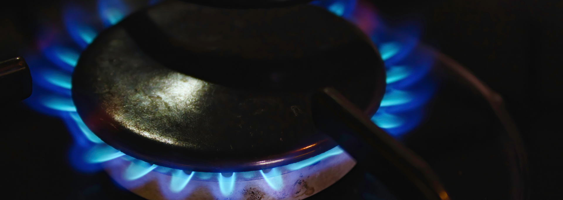 Picture of a a lit gas hob