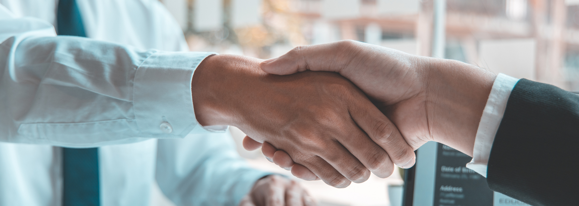 Picture of two people shaking hands after a job interview