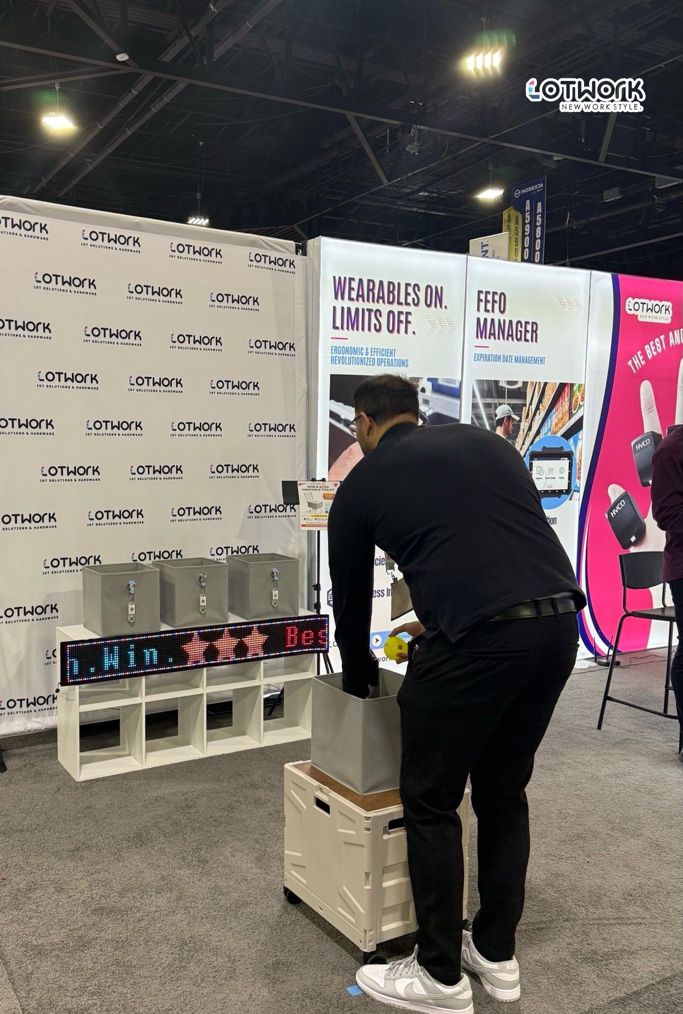 Live demonstration of pick-to-light warehouse solution using wireless light tags at Lotwork booth during MODEX