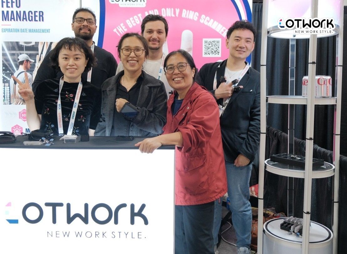 Lotwork team showcasing wearable warehouse solutions including ring scanners at MODEX logistics trade show booth