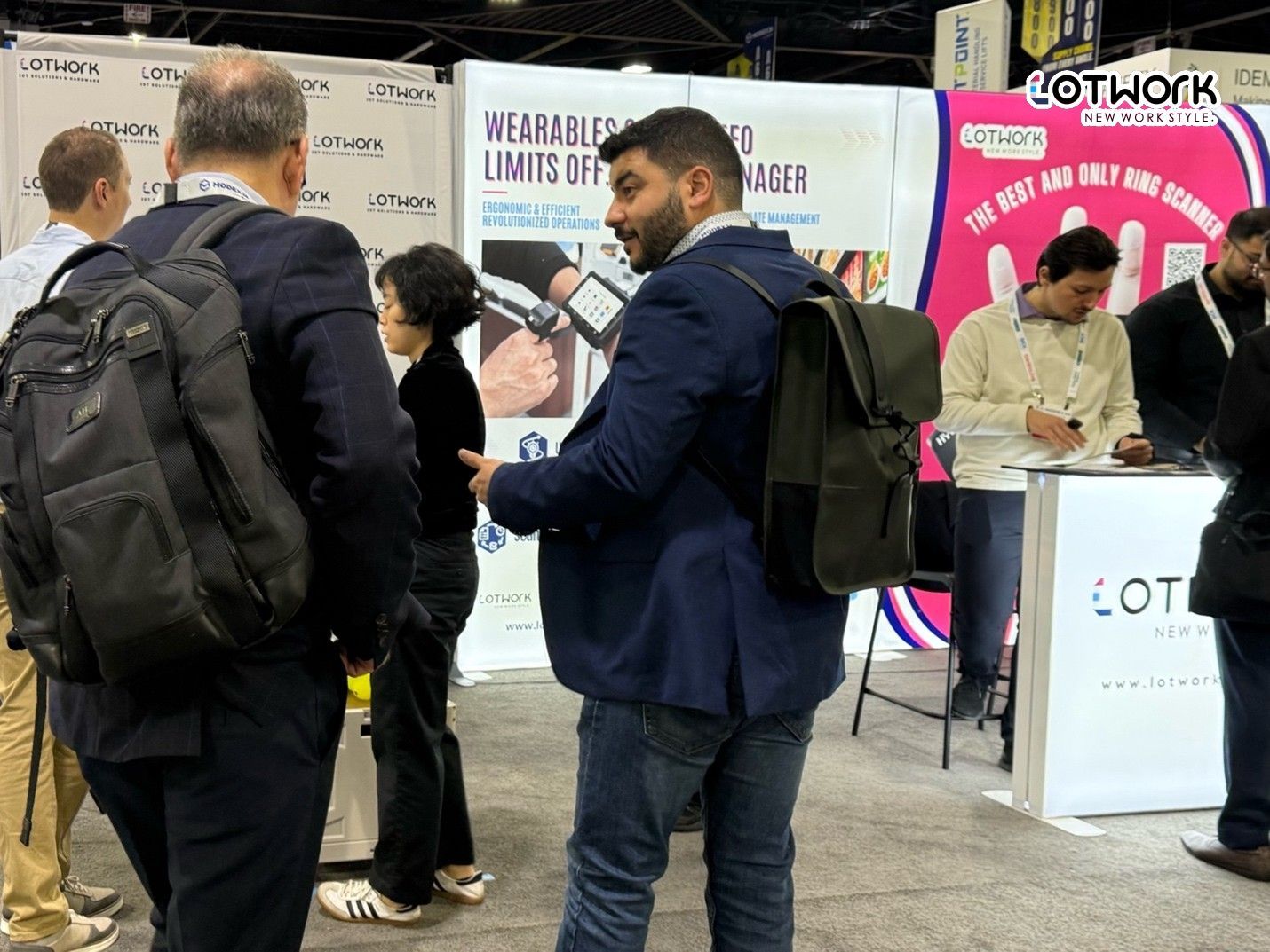 Visitors exploring Lotwork wearable technology and ring scanner solutions at MODEX supply chain exhibition
