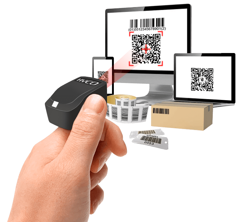 Hand holding a ring scanner scanning various barcodes on computer, phone, labels, and box.