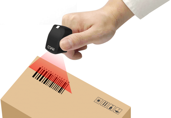 A person is scanning a barcode with Hyco Ring Scanner on a cardboard box