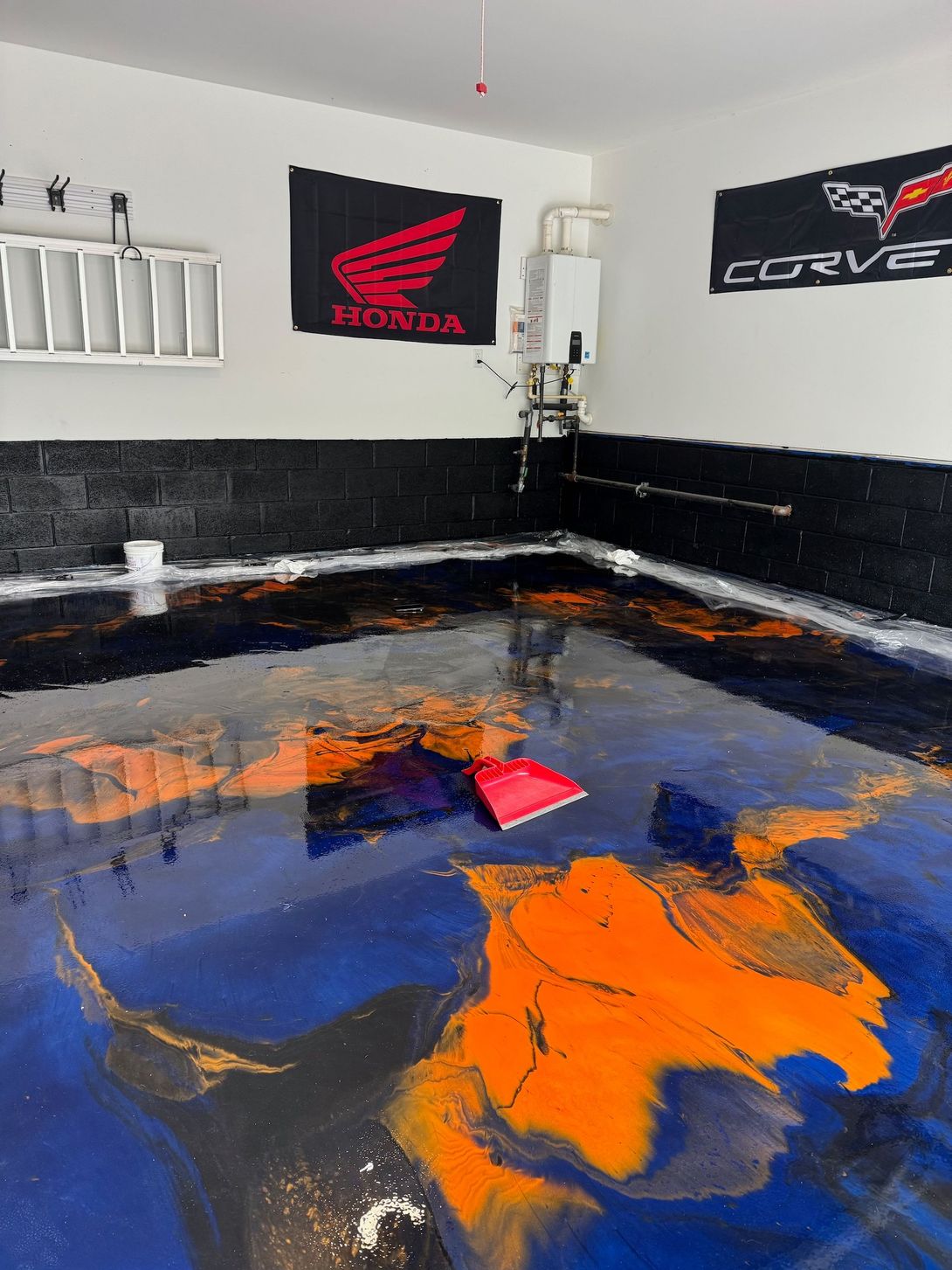 Concrete surface prep and grinding work in a residential garage by Archon Coatings TN