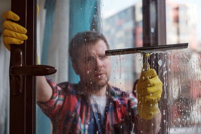 Man Cleaning Window — Riverside, CA — Custom Service Systems Clean