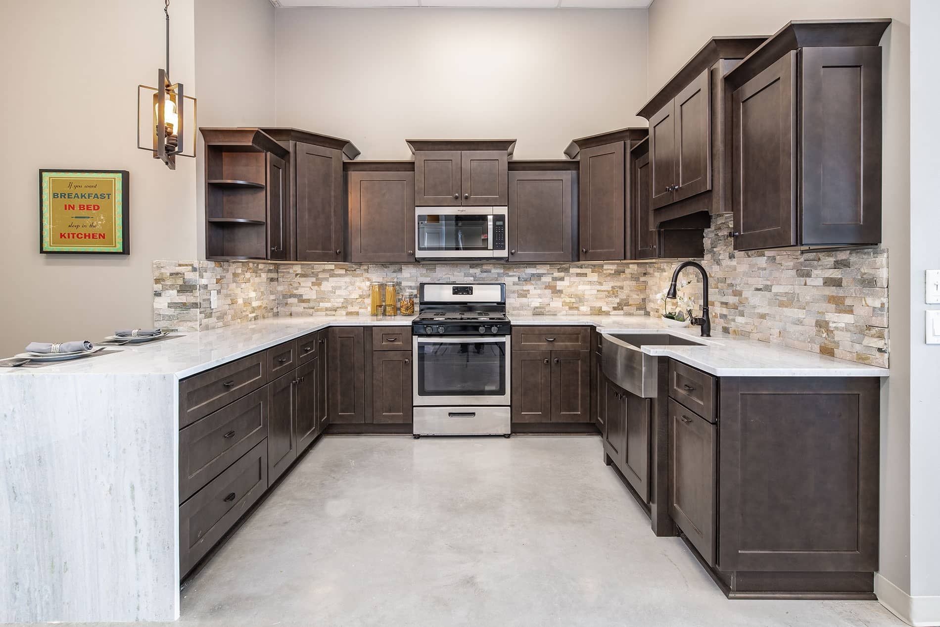 A kitchen with stainless steel appliances and wooden cabinets