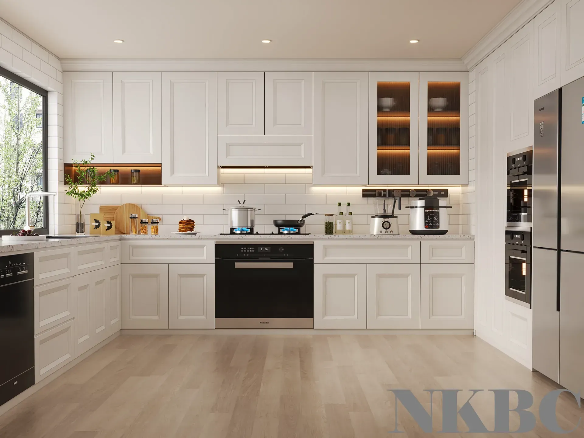 A kitchen with white cabinets and stainless steel appliances.