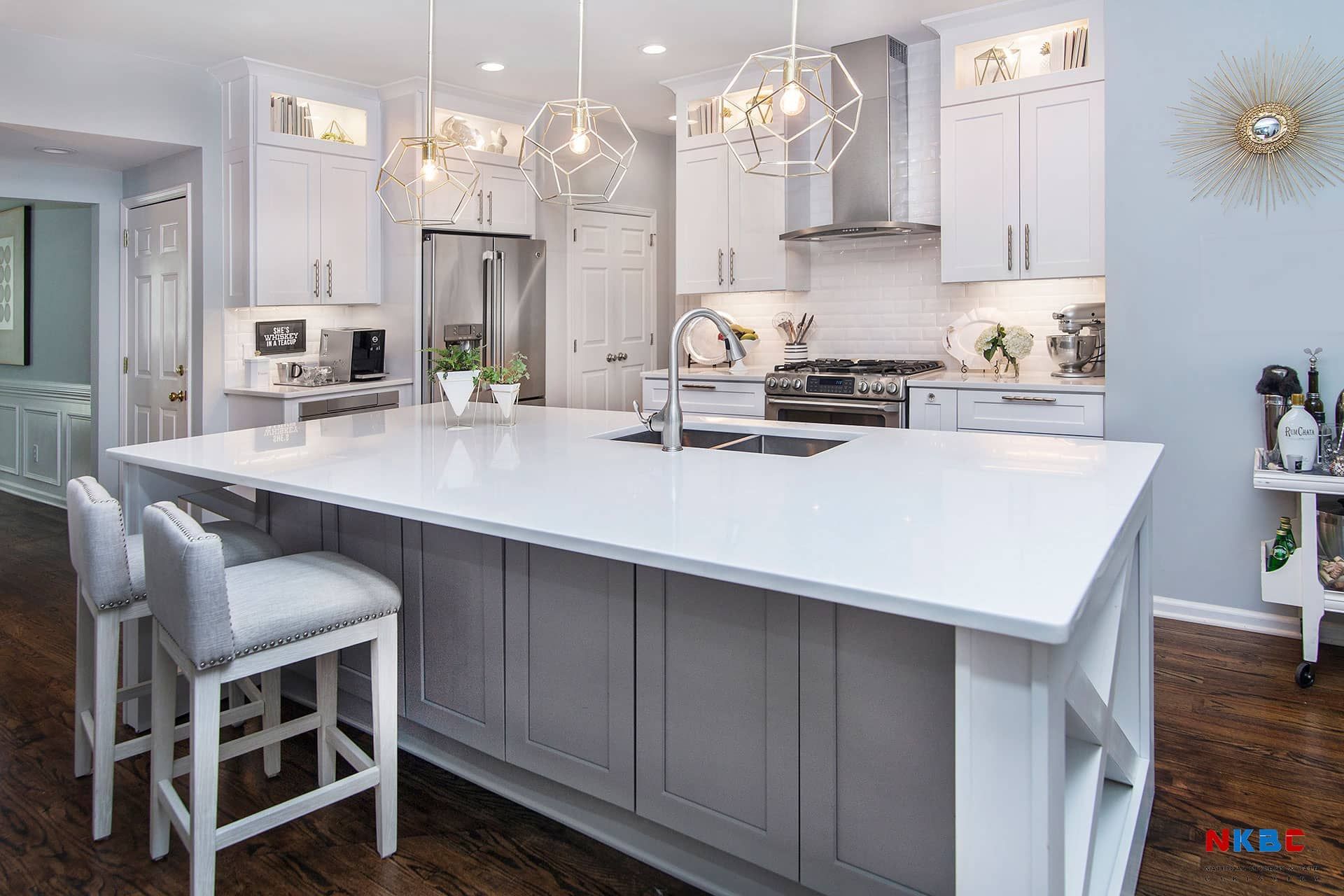 There is a large island in the middle of the kitchen.
