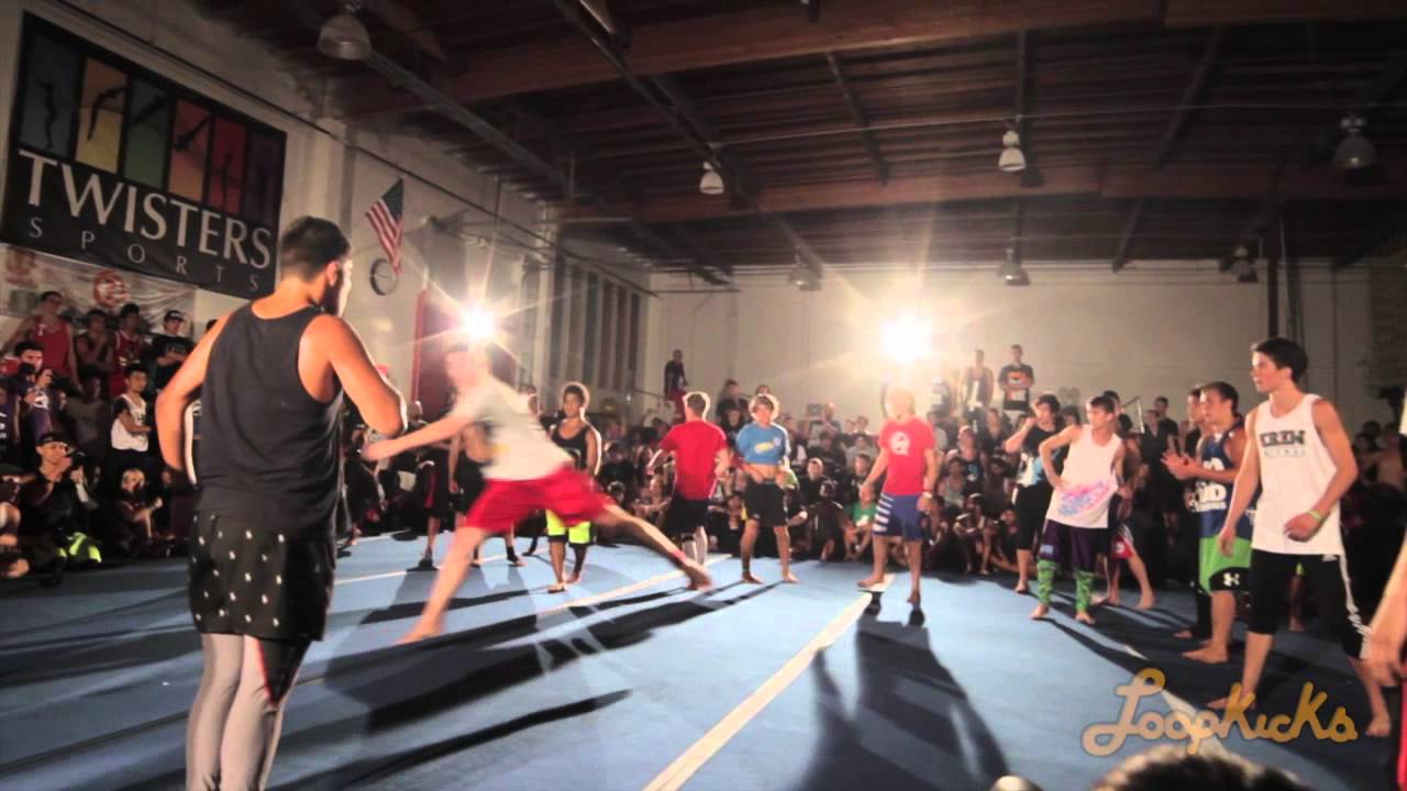 Tricking athletes battling and training during a live indoor movement and acrobatics event