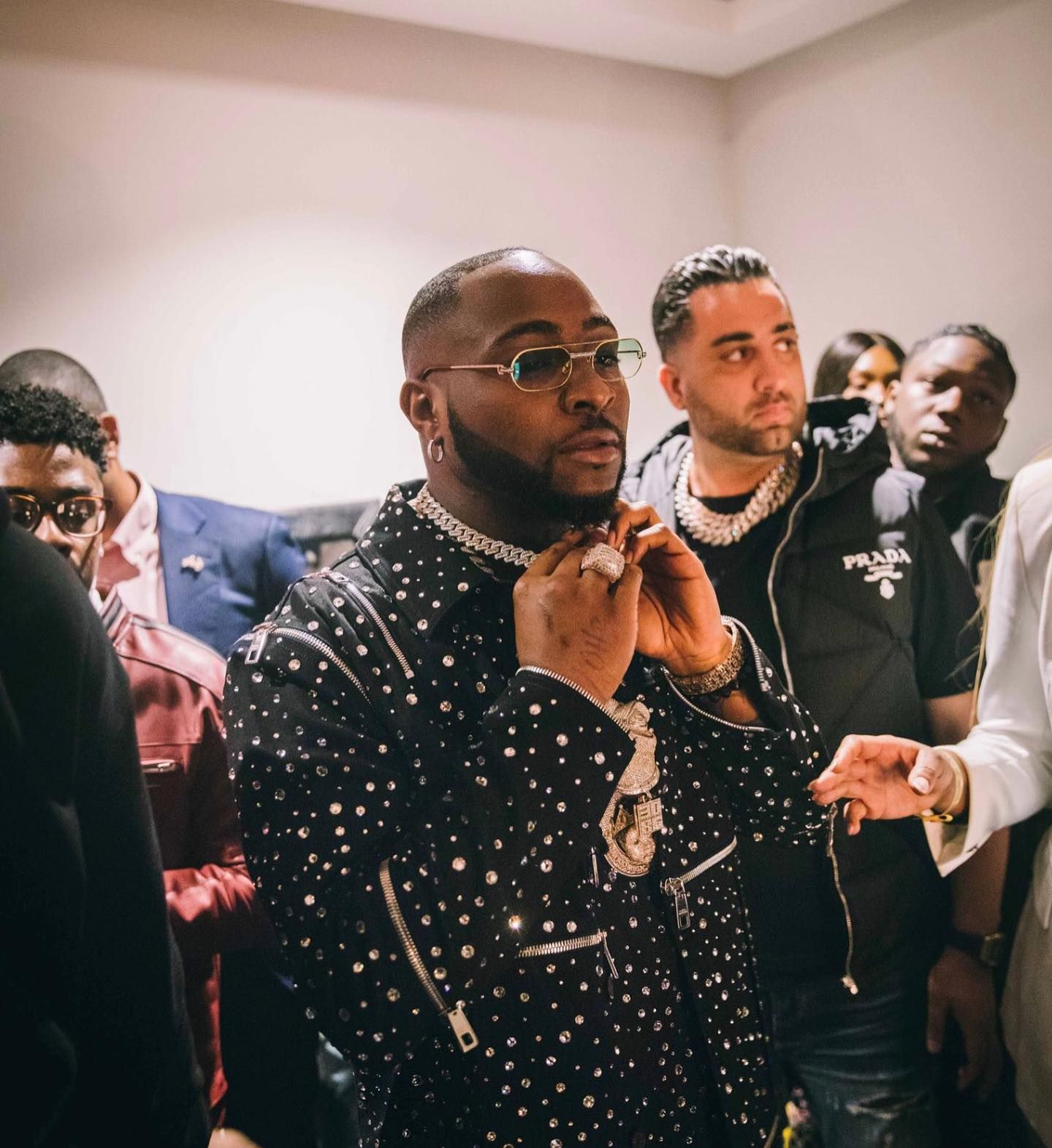 Benny The Jeweler revealing custom jewelry to Davido