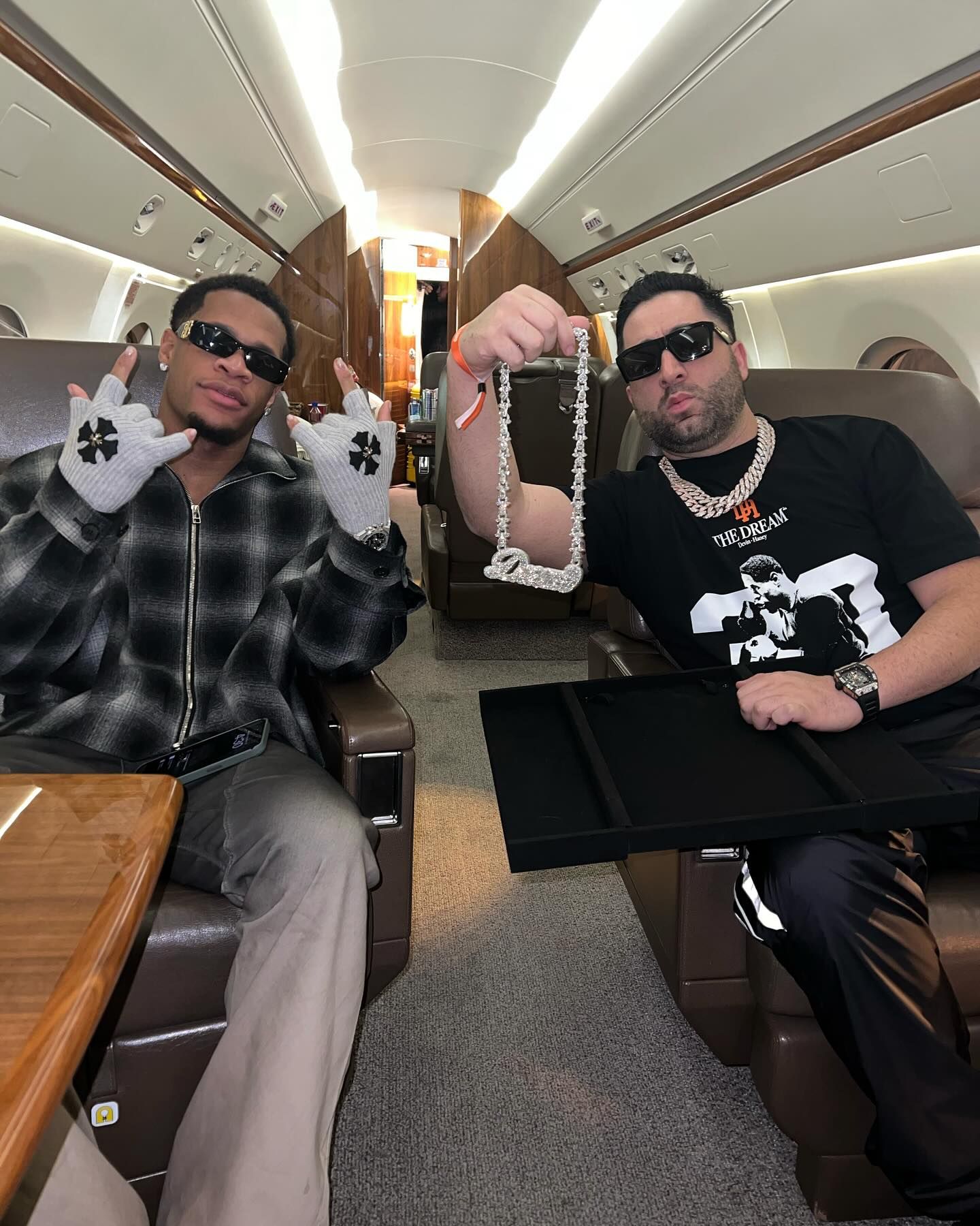 Benny The Jeweler revealing the new Dream Pendant to the Champ Devin Haney on a private jet