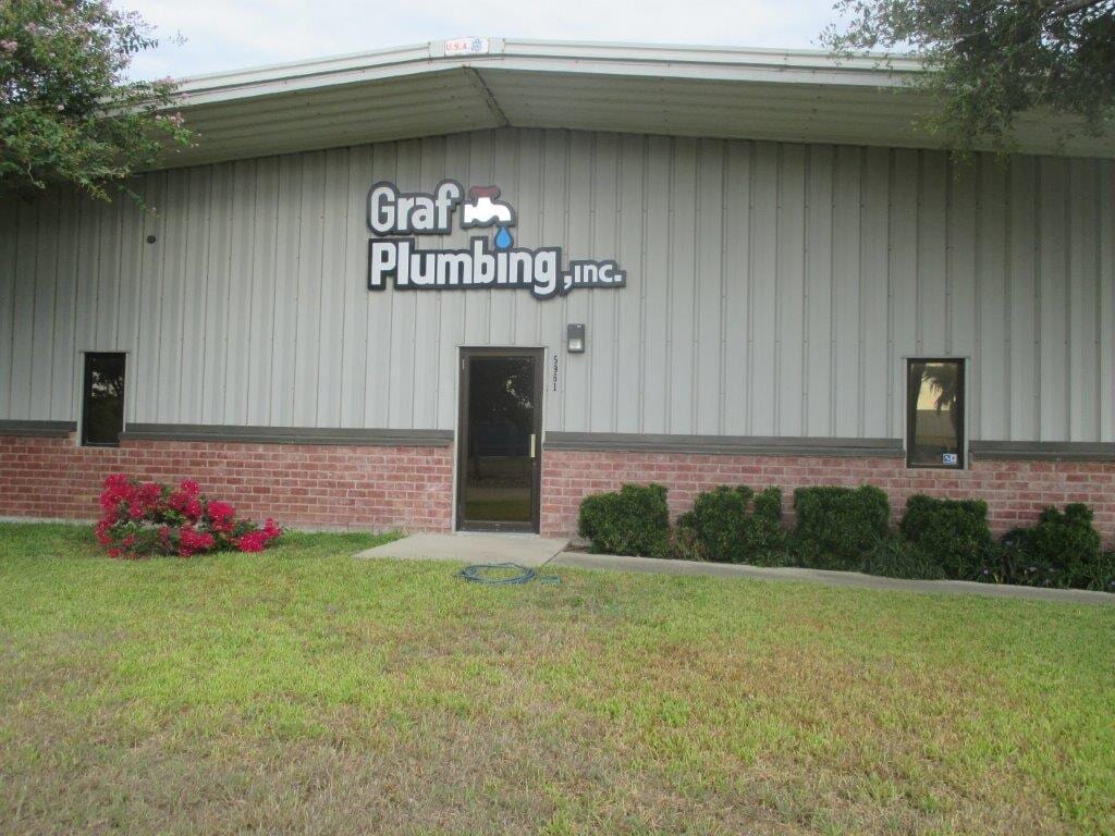 Plumber Screwing Plumbing Fittings in Bathroom — Plumbing Services in Corpus Christi, TX
