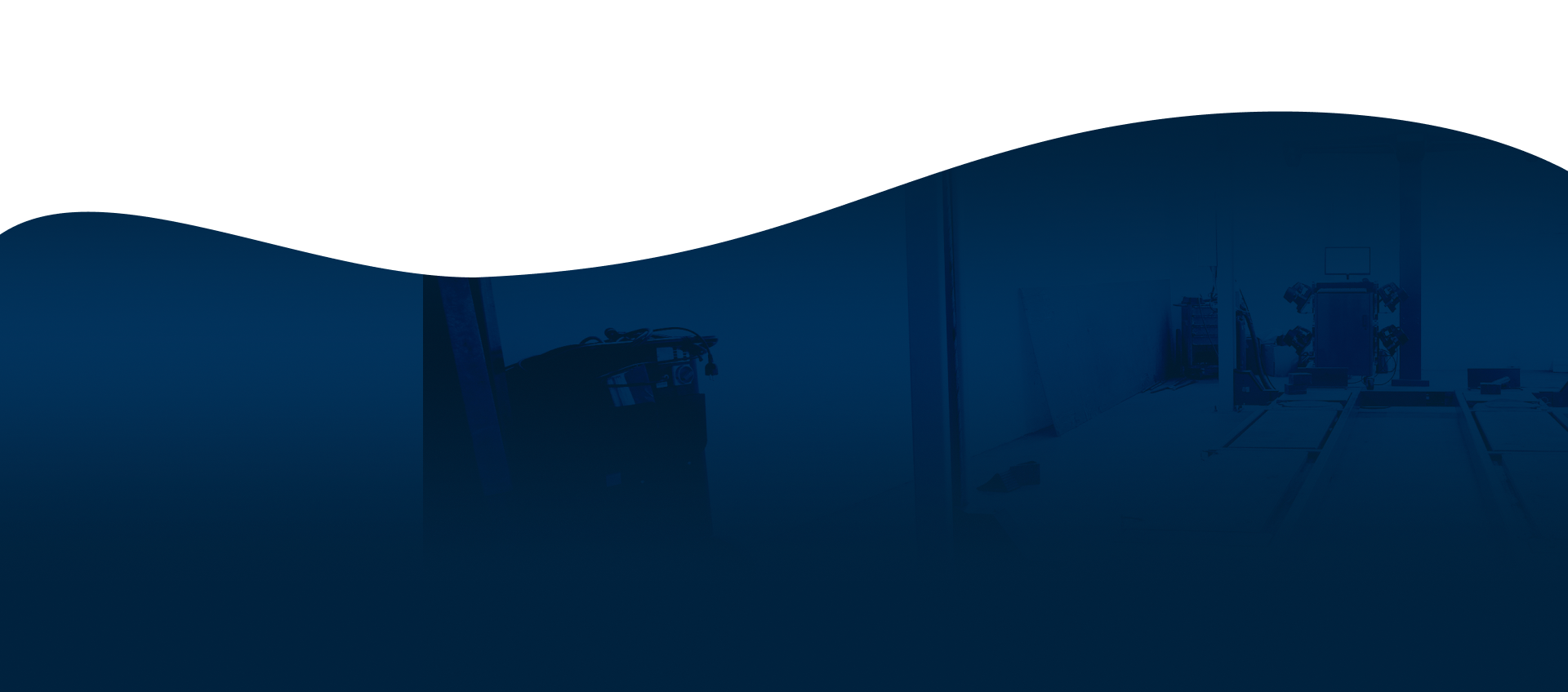 A dark room with a blue wave coming out of it. | North County Service Center