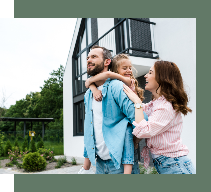 A family is standing in front of a house.