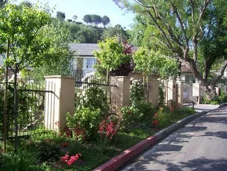 Metal fence next to nice flowers and plants — Chatsworth, CA — AC Horticultural Management, Inc.