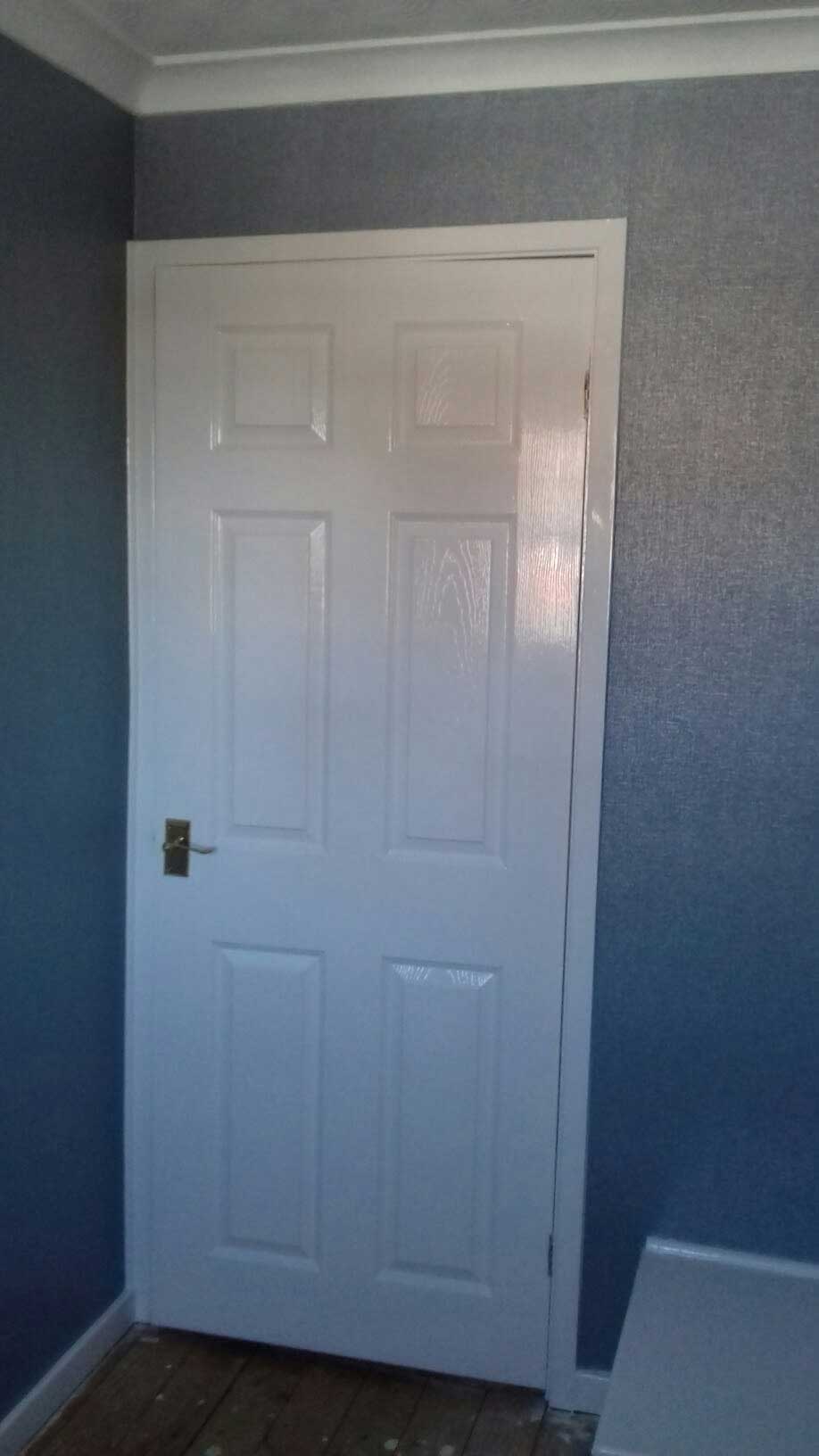 white door blue walls