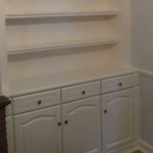 cream cupboard and shelf unit