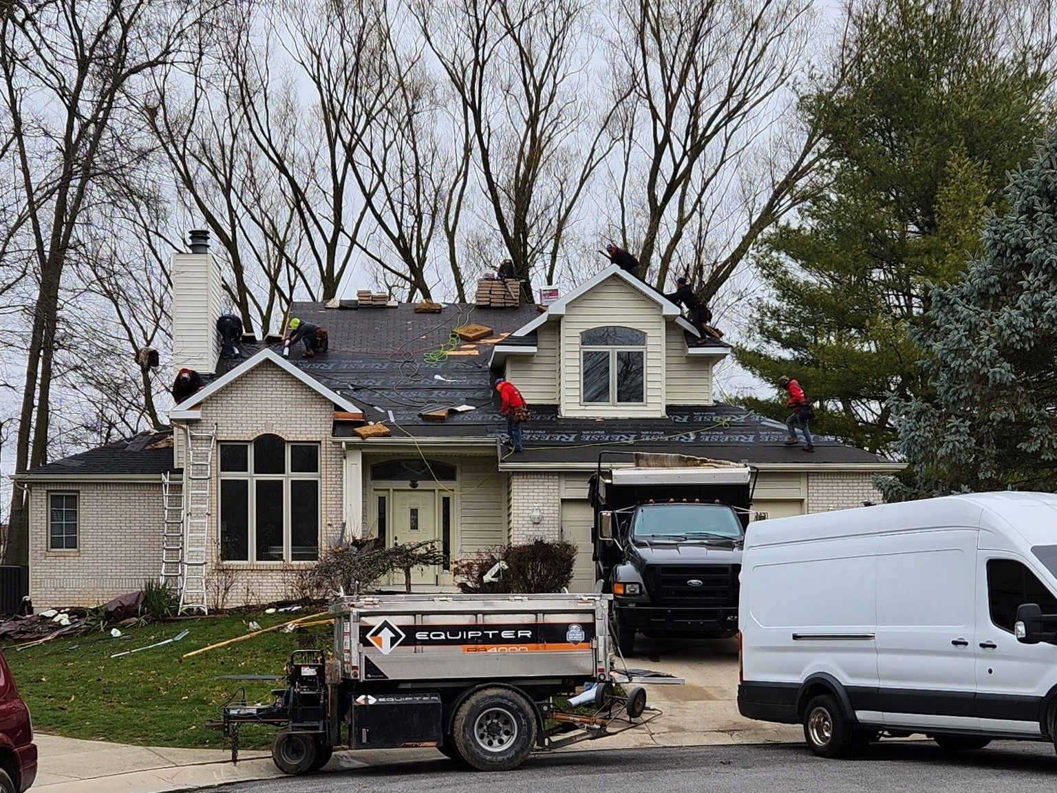 Two Construction Workers Are Working on The Roof of A House | Shelbyville, IN | SL Construction