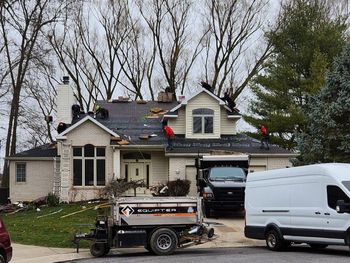 Two Construction Workers Are Working on The Roof of A House | Shelbyville, IN | SL Construction