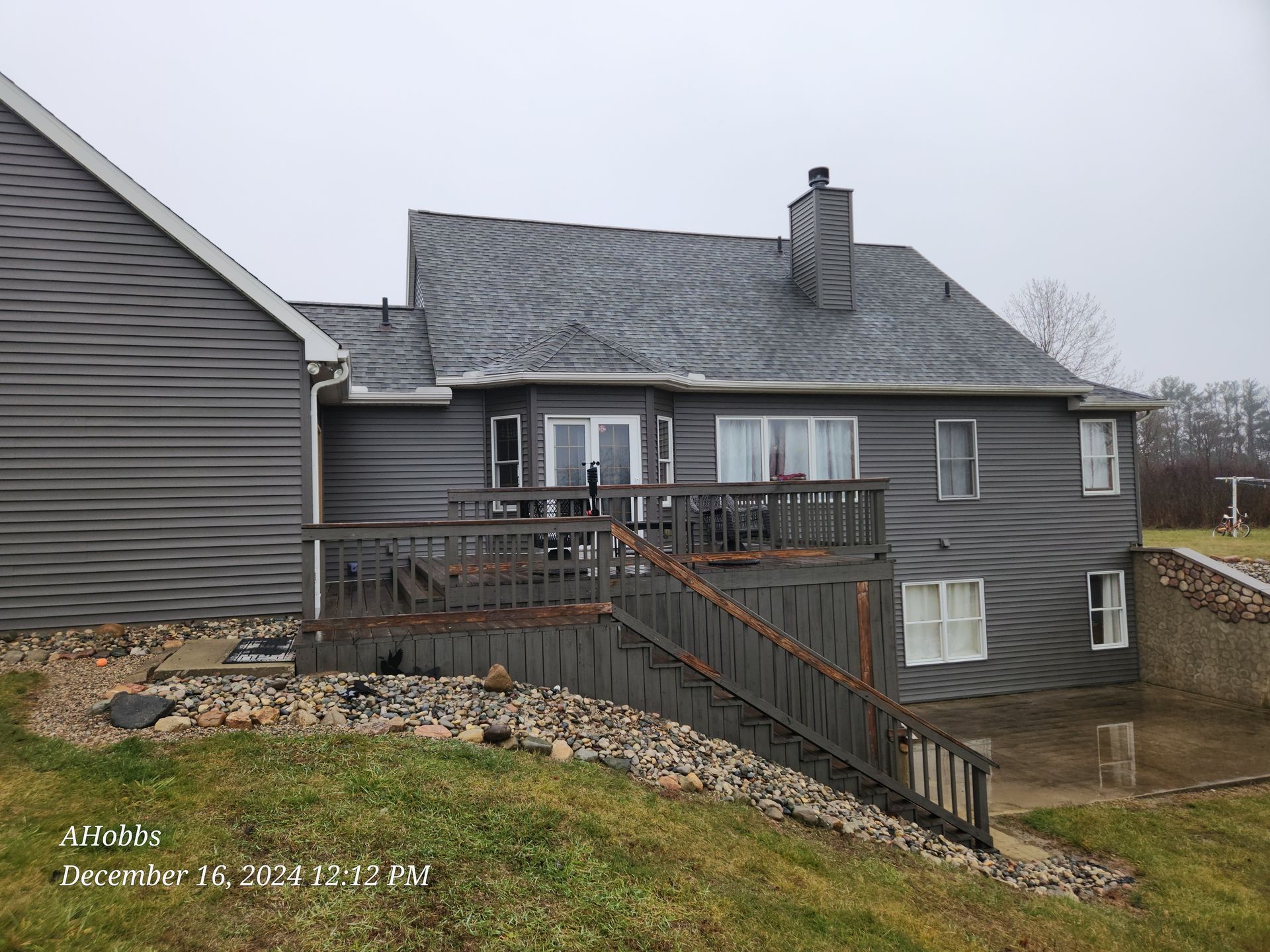 The back of a house with a deck 