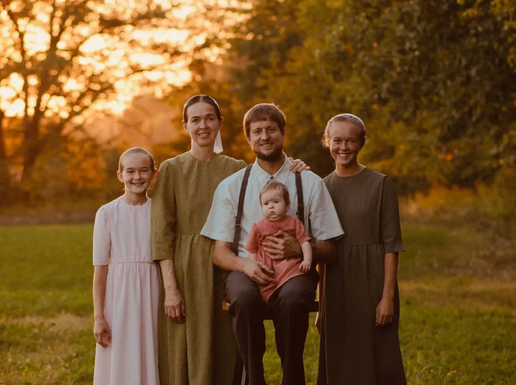 A Family Is Posing for A Picture in A Field | Roofing company serving Shelbyville, IN