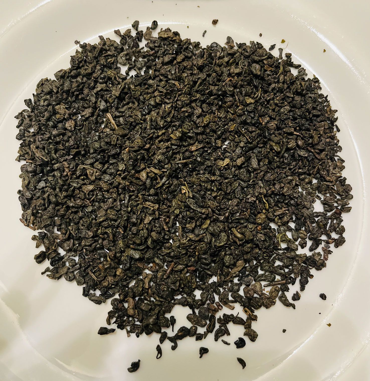 Tiny pearls, hand-rolled, leaf by leaf, made of some of the finest Chinese green tea make up this Gunpowder Temple of Heaven Green Tea. The grey-green balls are known as zucha or 