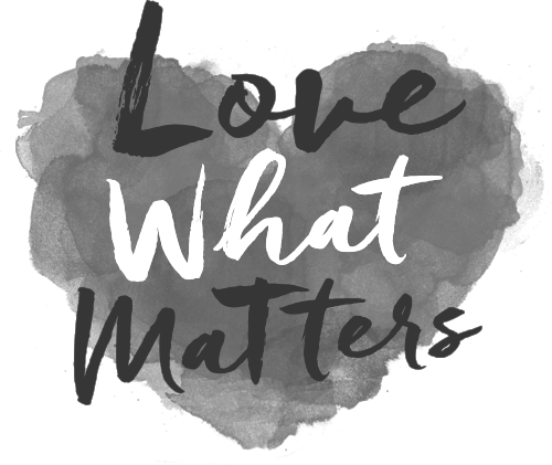 A black and white heart with the words `` love what matters '' written on it.