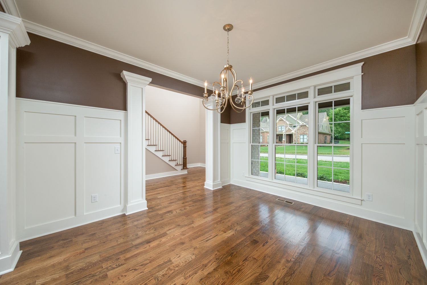 A man is painting a wall with a brush.