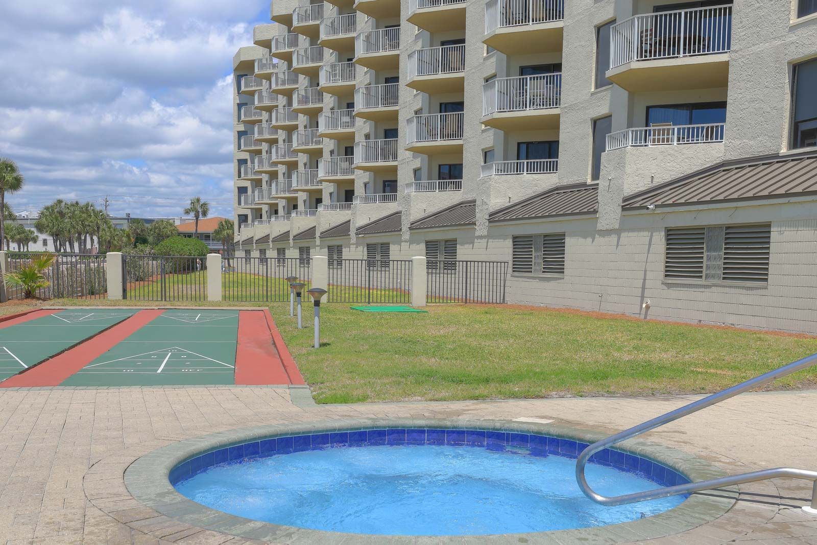 A large building with a hot tub in front of it