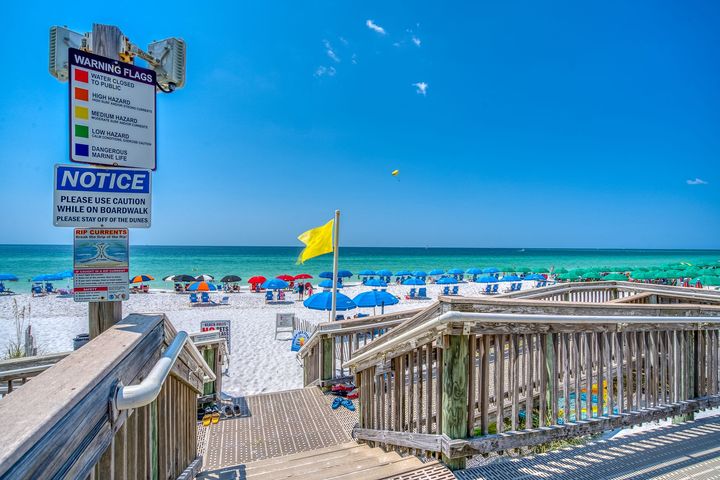 There is a notice sign on the side of the beach.