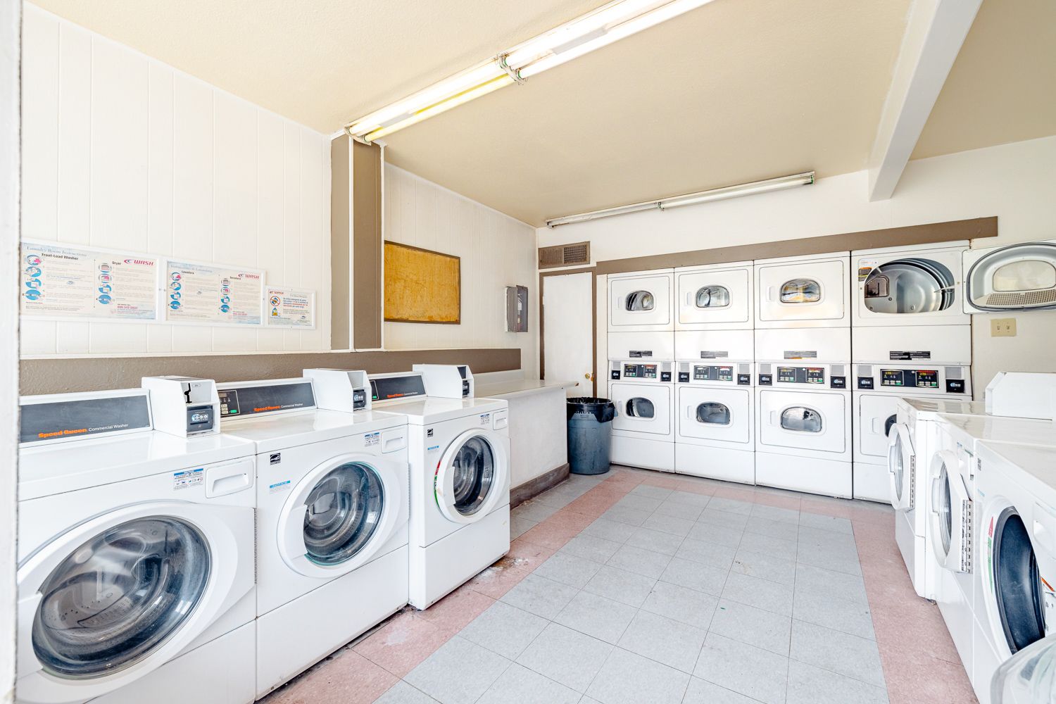 a laundromat filled with lots of washers and dryers