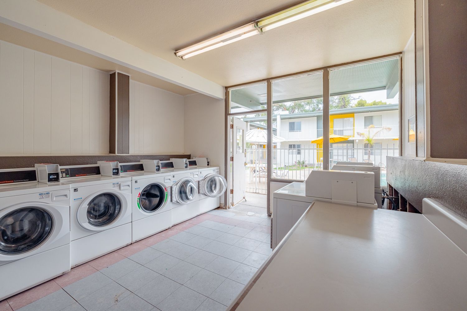 a laundromat filled with lots of washers and dryers