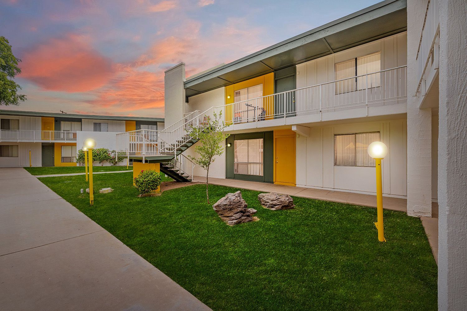 a building with stairs leading up to the second floor