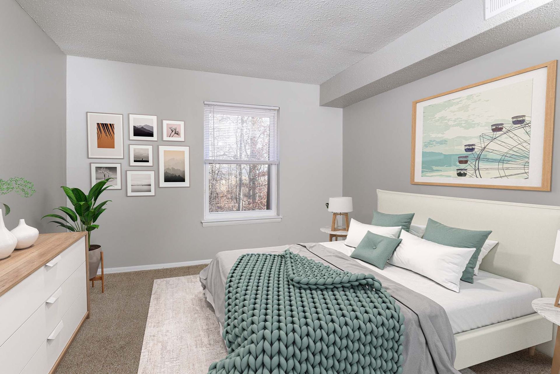 Bedroom in an apartment with a bed, dresser, plant, and wall art.