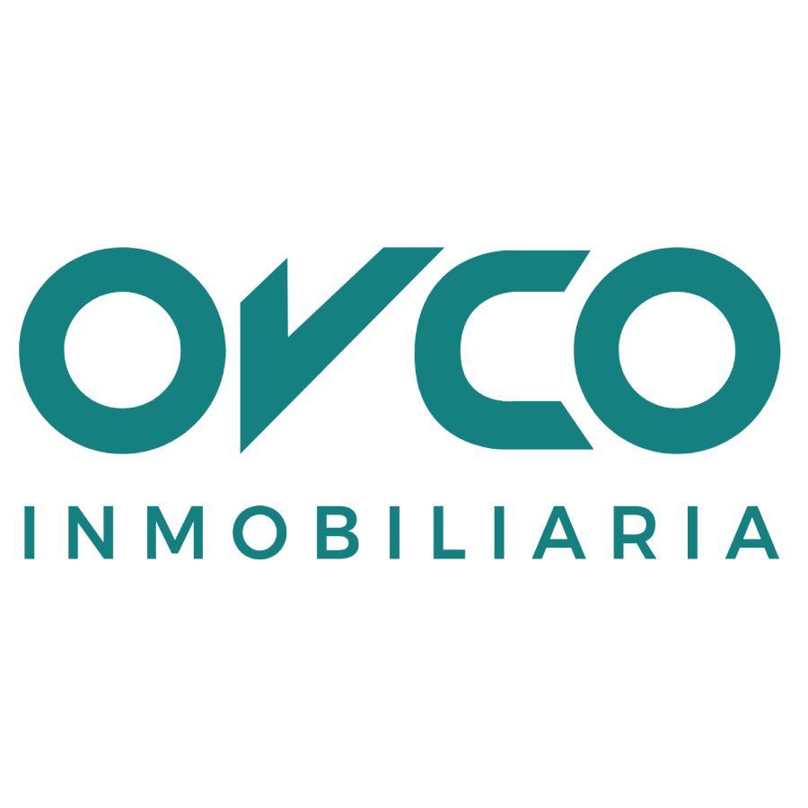 Logotipo de OVCO Inmobiliaria en color gris.