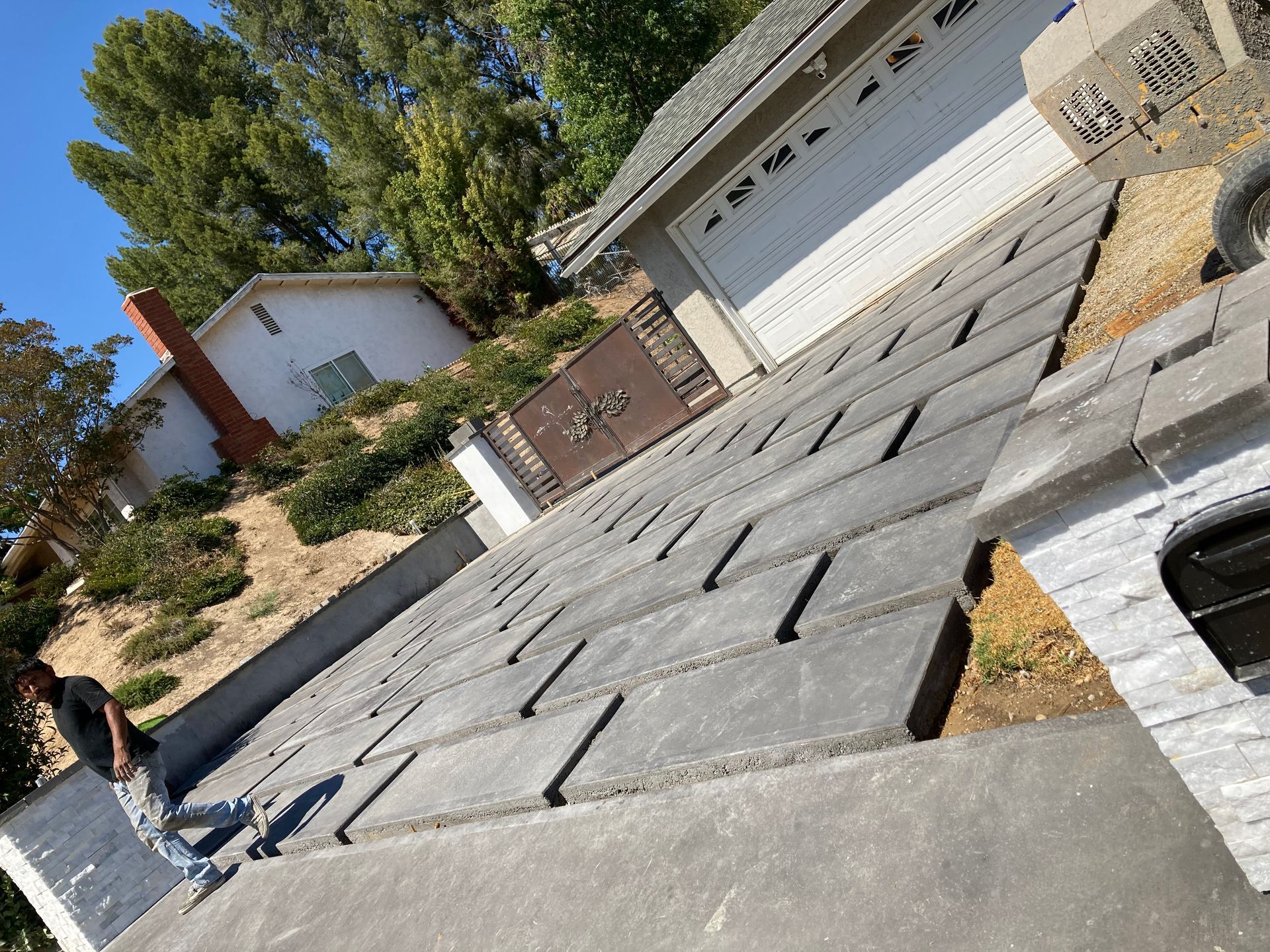 A man is standing on the roof of a house.