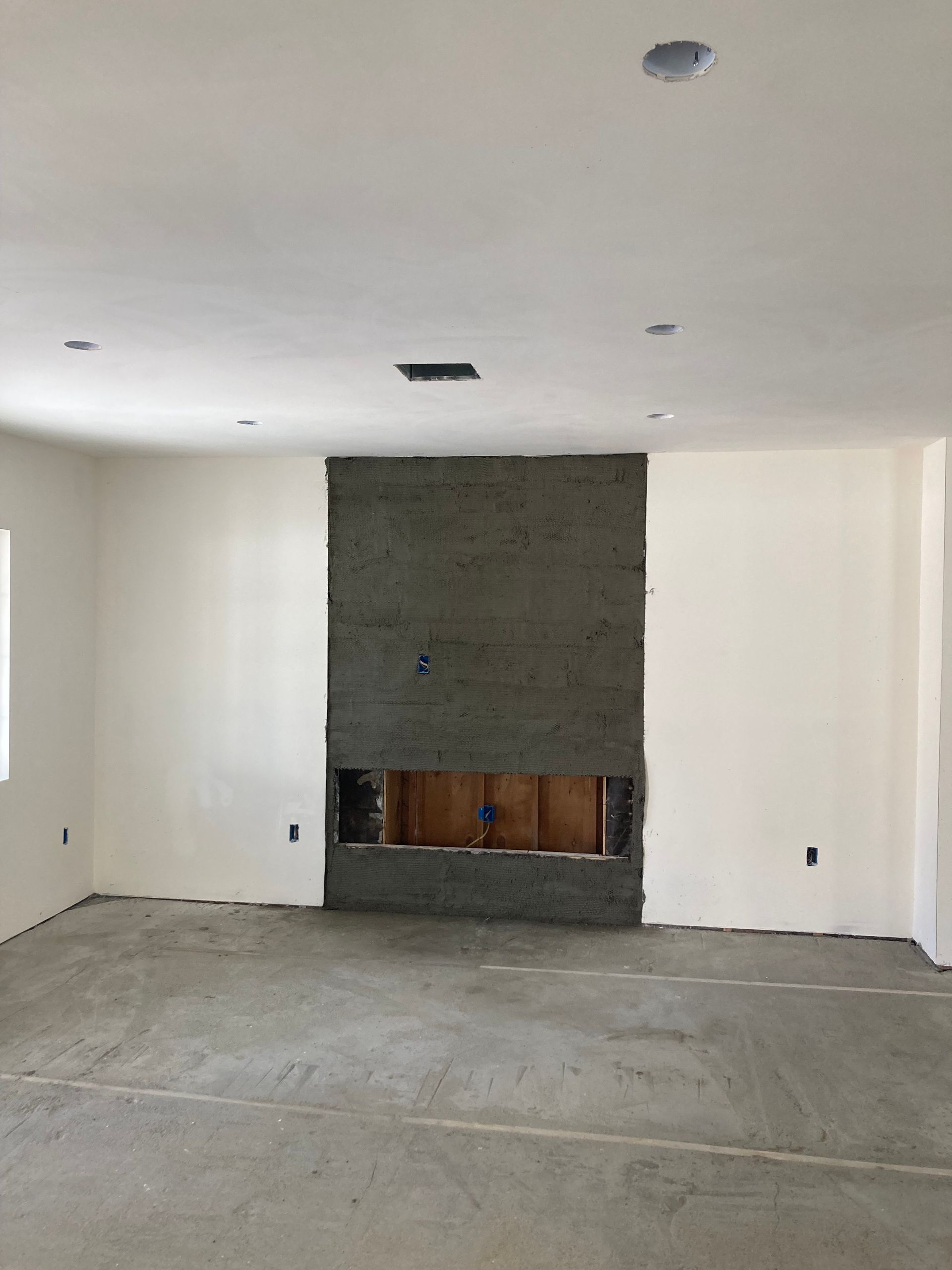 There is a fireplace in the middle of the room.