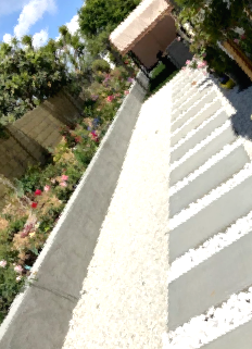 A staircase with white gravel on the side of it