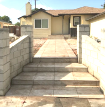 A house with stairs leading up to the front door
