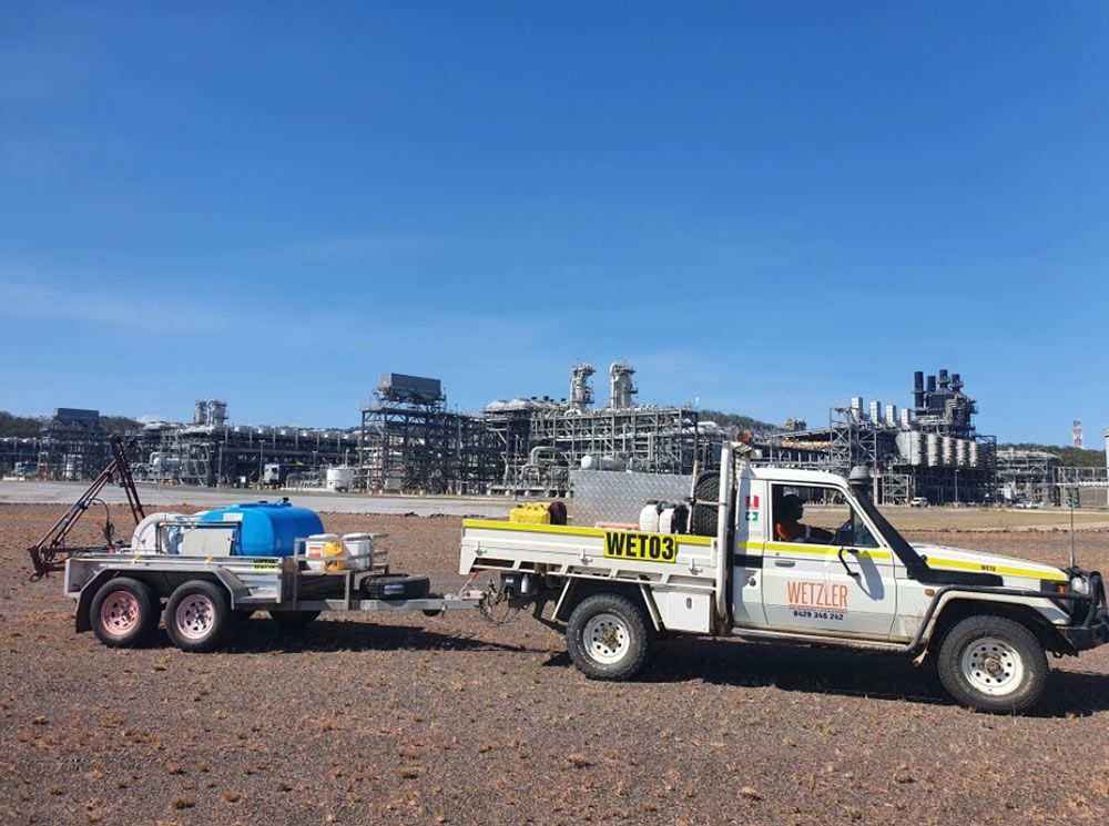 Truck With A Trailer Attached To It Is Parked In A Dirt Field — Wetzler Pty Ltd In Marmor QLD