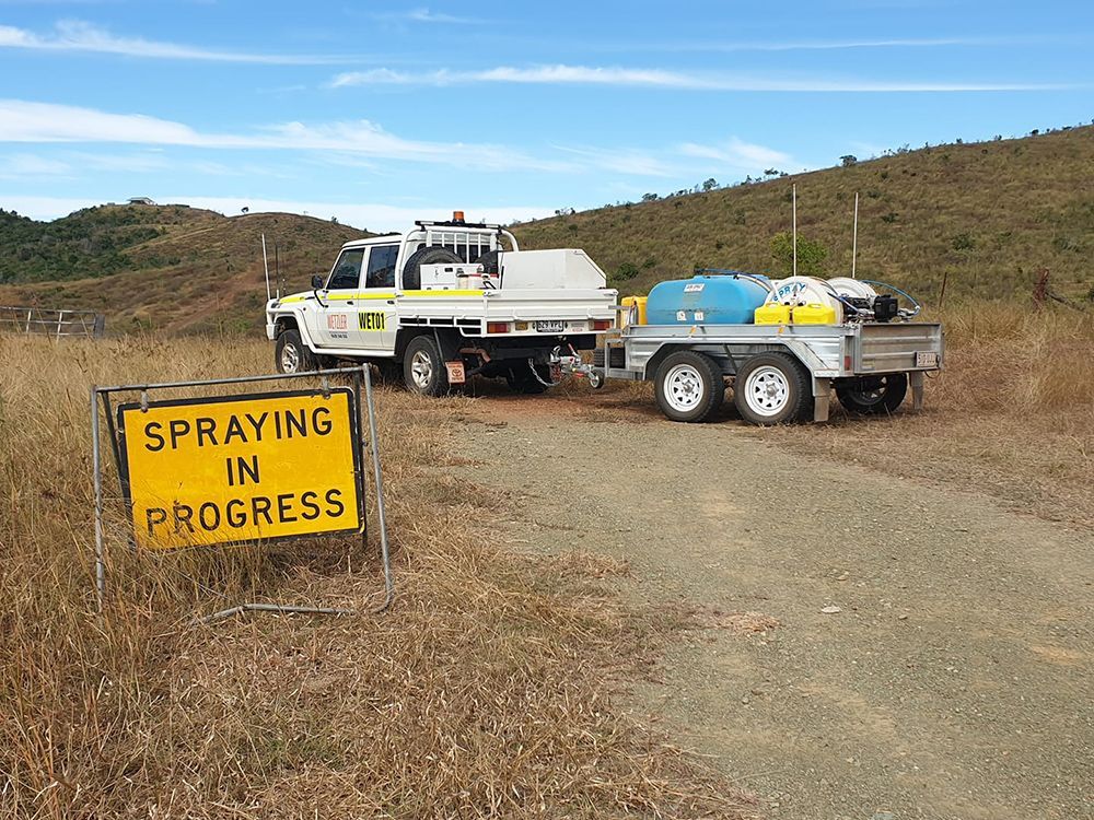 Wet01 pickup with trailer Spraying in Progress — Wetzler Pty Ltd In Marmor QLD