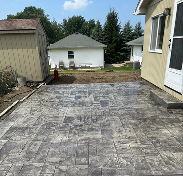concrete patio pad in backyard of Erie, PA home
