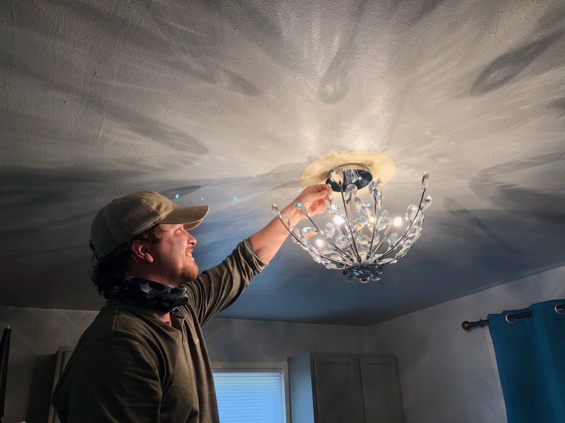 Electrician installing Light — Norman, OK — Waters Electric Inc