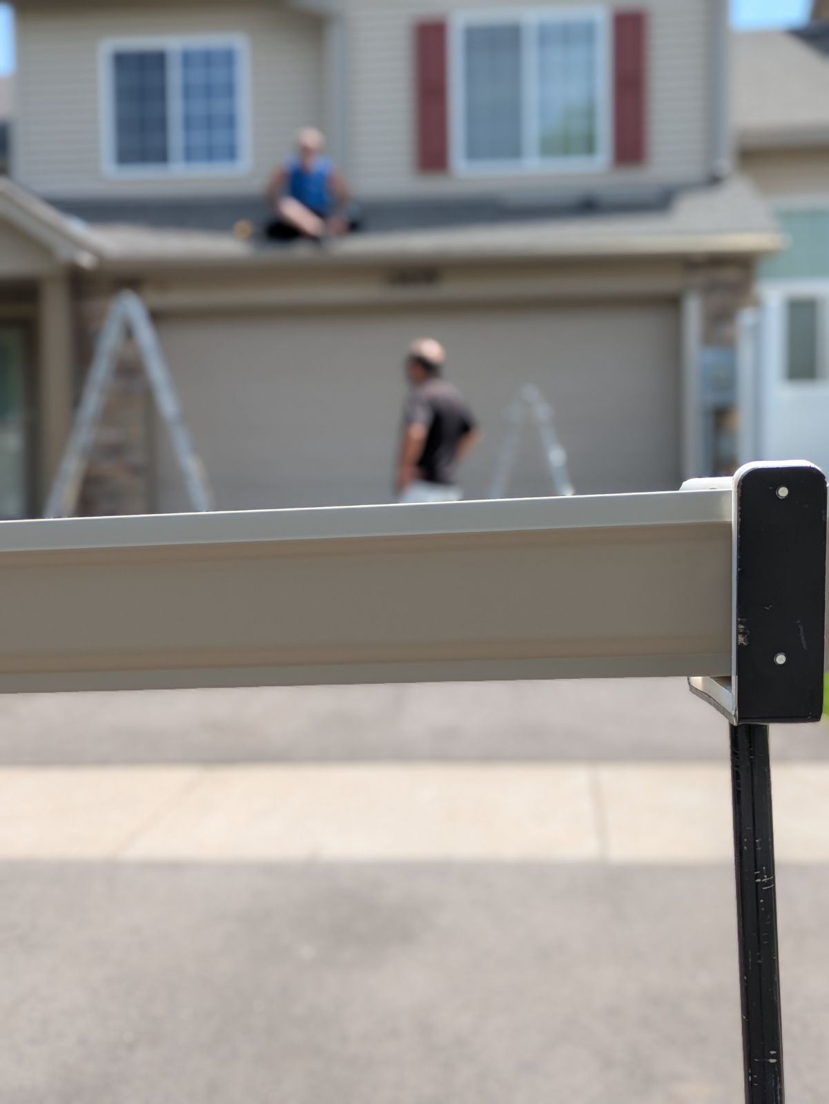 Close Up of Gutter Being Installed on a Townhome in Andover, MN